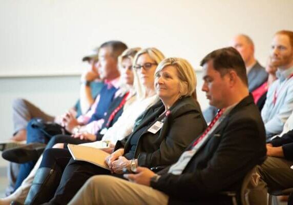 Group of people sitting and listening